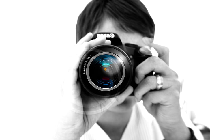 closeup photo of person holding camera