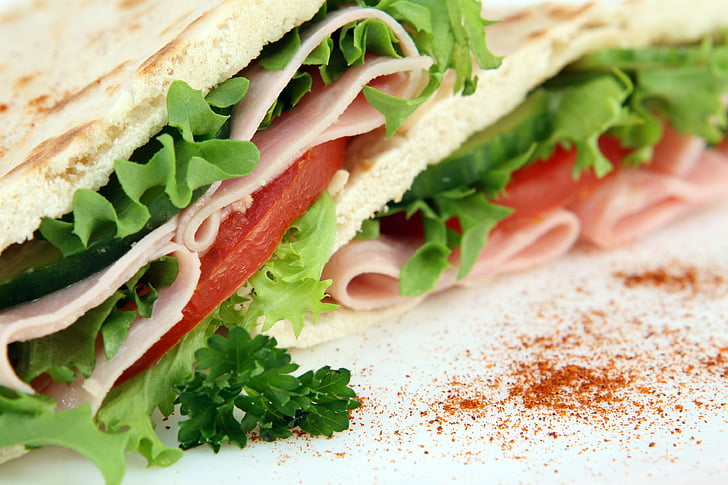 Royalty-Free photo: Sandwich with lettuce, sliced tomatoes, and cold cuts |  PickPik