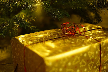 close up photo of yellow Christmas gift box