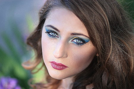 woman in blue eyeshadow in focus photography