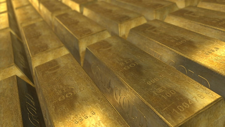 closeup photo pile of gold bars