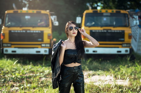 woman wearing black latex crop top and leggings