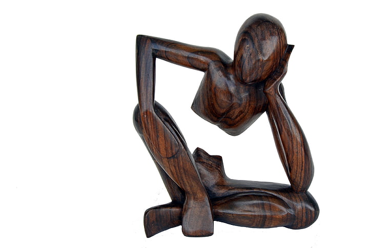 brown wooden human figure sculpture