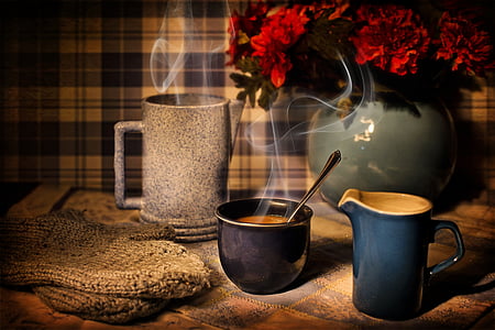 blue ceramic mug full of coffee on table