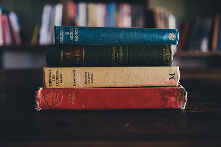 photo of four assorted-title books