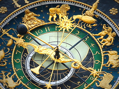 green and gold-colored astronomical device