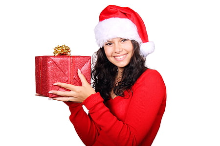 woman in Santa suit holding red box