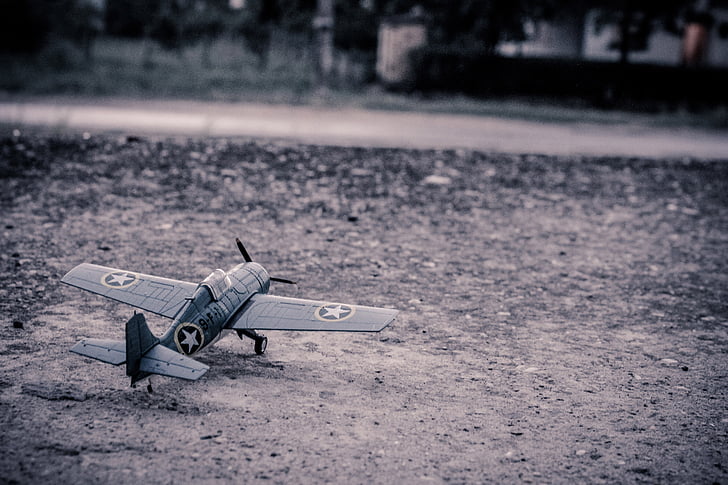 grey military biplane scale model