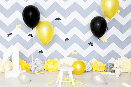 white-and-gray chevron wall with assorted-color balloon photo booth