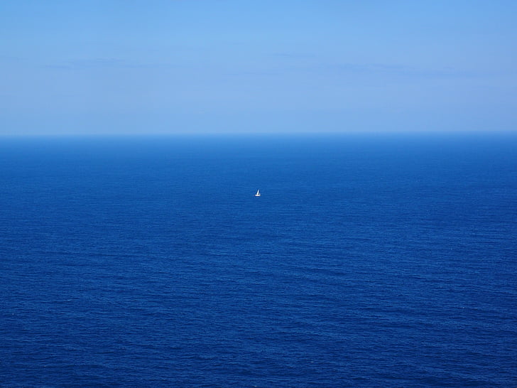 white boat in the middle of sea