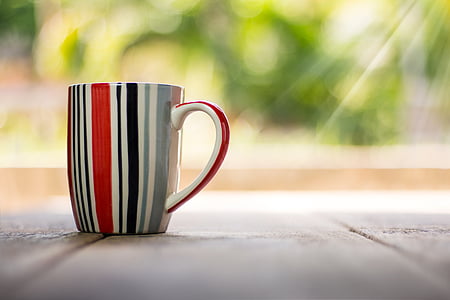 red, black, and gray striped ceramic mug