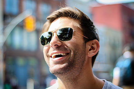 man wearing gold framed sunglasses