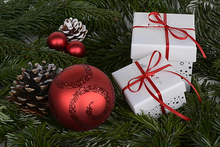 three red baubles with two white gift boxes