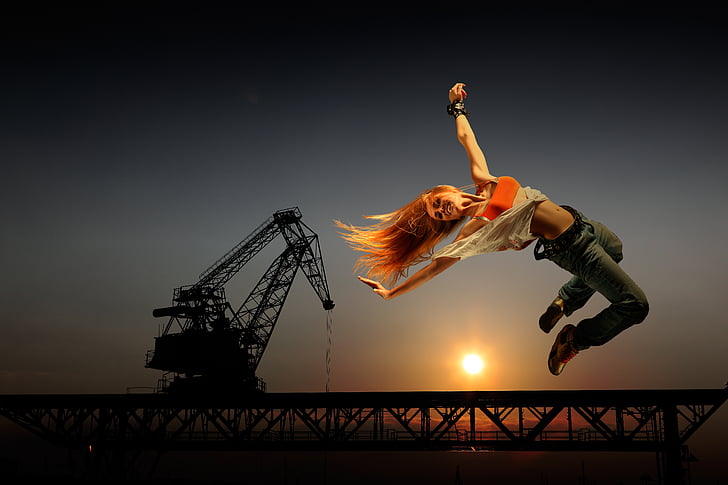 Royalty Free photo Woman on air with crane background 