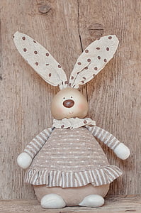 photo of rabbit wearing gray polka dot shirt plush toy