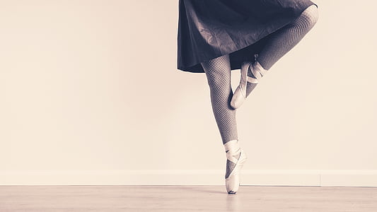 grayscale photo of person doing ballet move