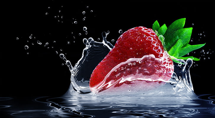 time lapse photography of strawberry splashing on water