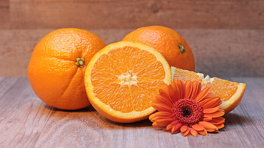 four sliced orange fruits