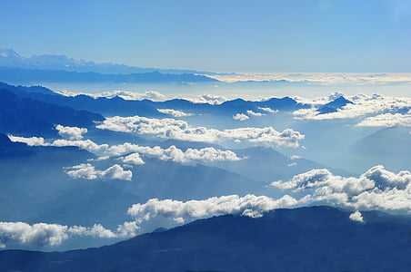 aerial photography of mountain with clouds during daytime