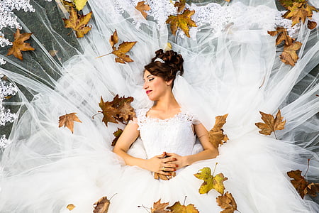 woman wearing white wedding gown posing for photo