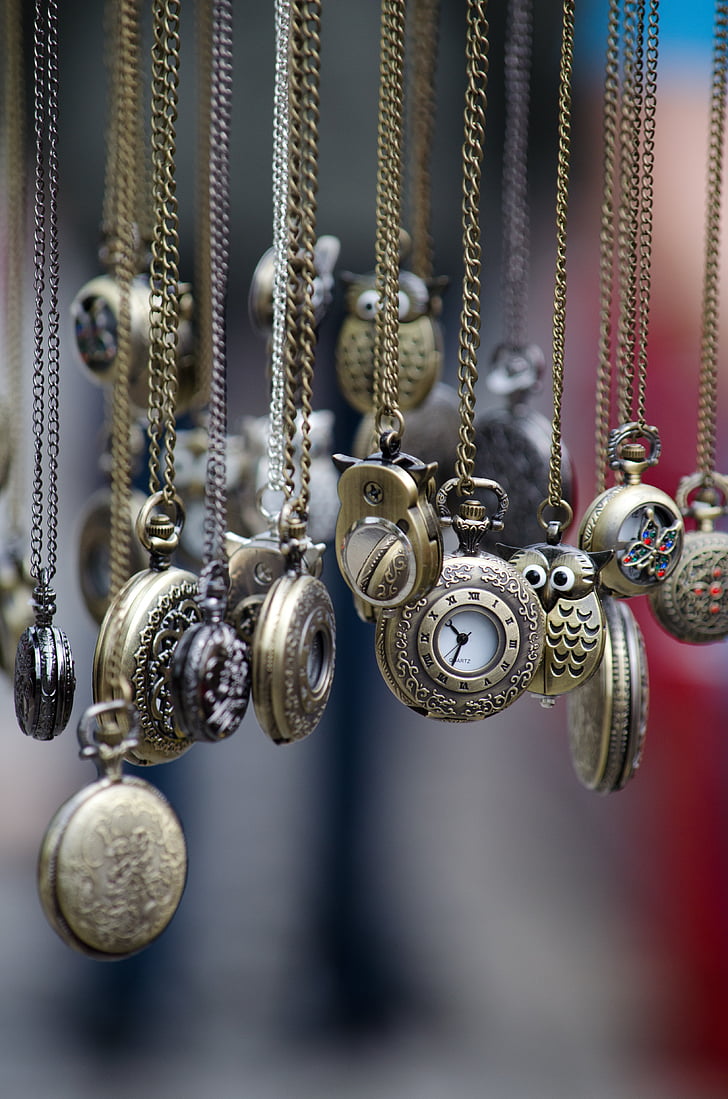 assorted pocket watches in shallow focus lens