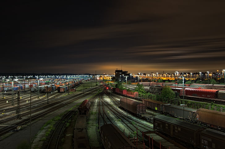 red and black train rail at night time
