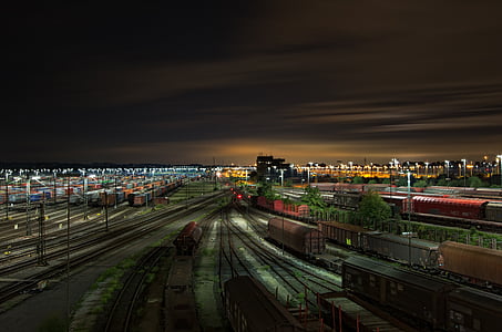 red and black train rail at night time