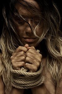 woman with brown rope on her hand