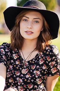 woman wearing black summer hat