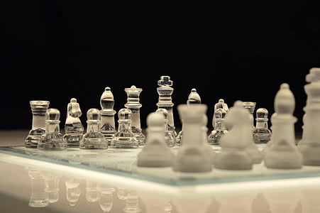 clear glass chess board and piece