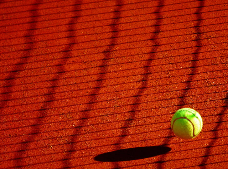 green tennis ball at daytime
