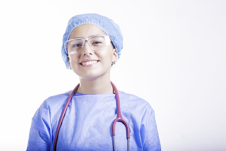 A young brunette female doctor in a dress with a stethoscope Stock Photo |  Adobe Stock