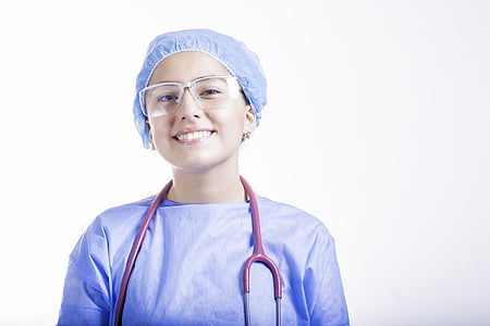 female doctor wearing glasses and blue medical dress