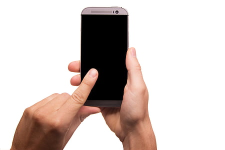 person holding gray HTC One M8 smartphone