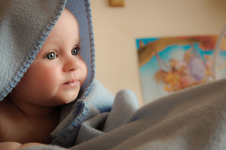 shallow focus photography of infant