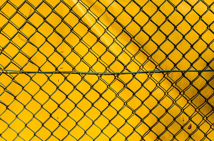 closeup photo of black wire metal fence