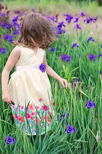 girl wearing yellow v-neck sleeveless mini dress on purple flower field