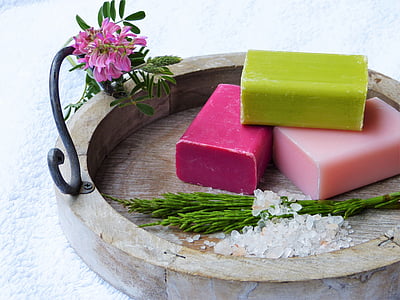 green, red, and pink soap on brown tray