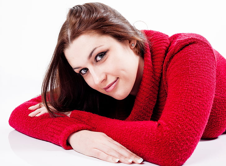 woman wearing red knitted sweater]