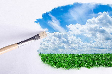brown wooden paintbrush painting green plant field under white clouds blue sky