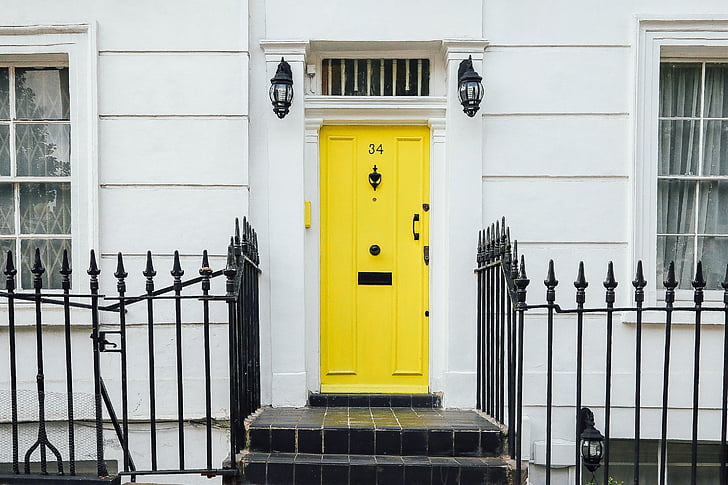 yellow door with gate