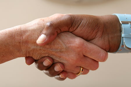 two person shaking hands