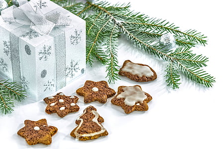 five assorted-shape baked cookies near white gift box