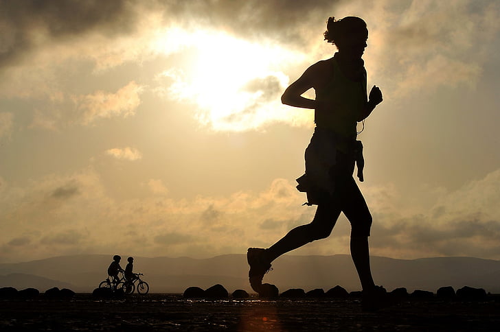 silhouette photo of person jogging