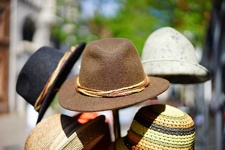 assorted-color hats on hat stand