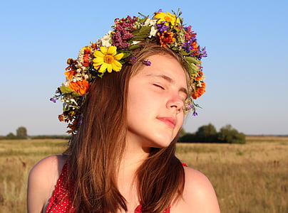 woman wearing floral head dress