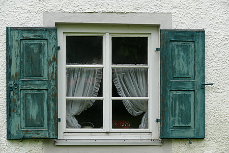 white and green wooden window