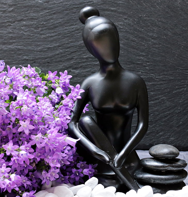 woman figure near purple flowers