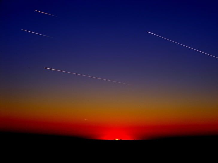 shooting stars photo during sunset