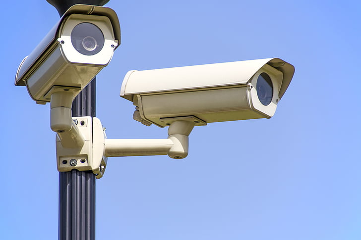 two white surveillance cameras